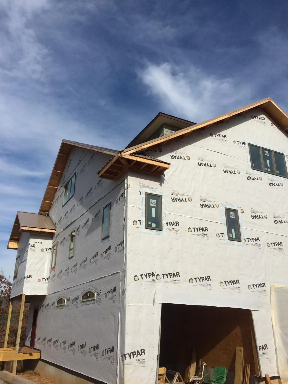 Stick built house wrapped in Typar with new roof framing and dormers in Fraser